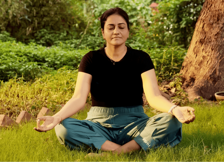 Shuchita practising yoga