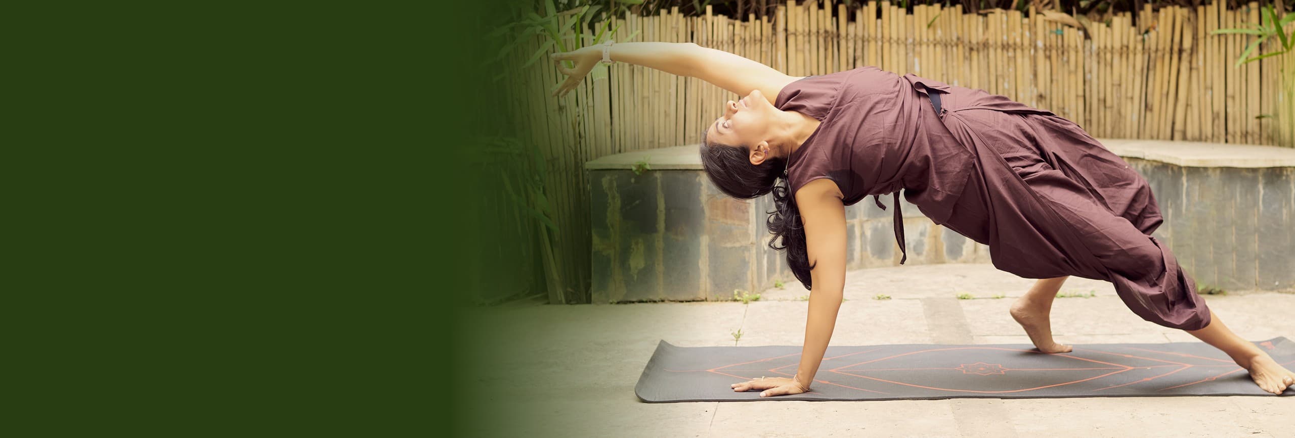 Woman in a side plank yoga pose