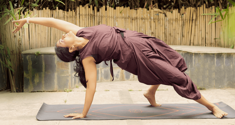 Woman in a side plank yoga pose